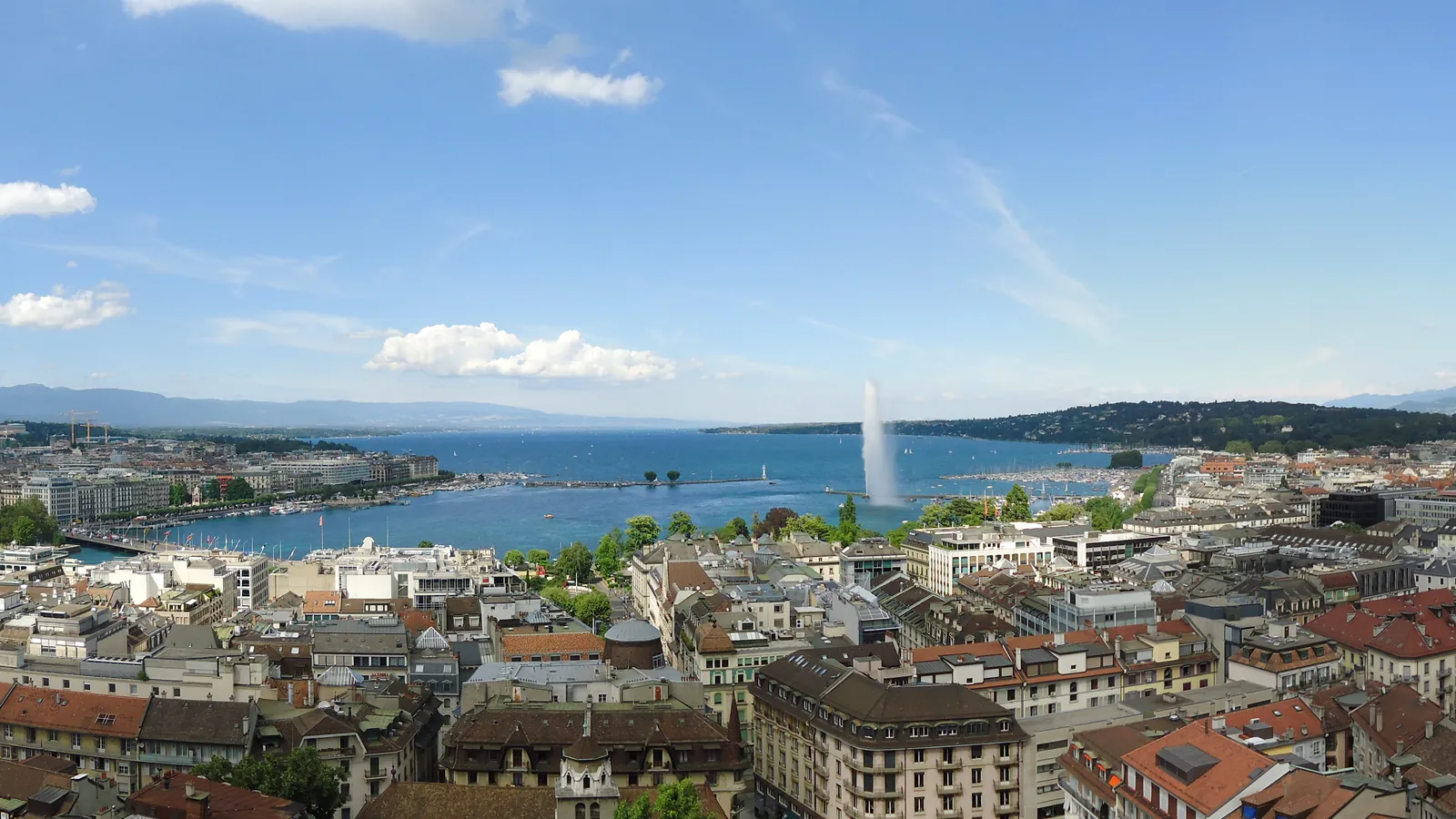 The rooftops of Geneva, Lake Geneva, and the Jet d'Eau