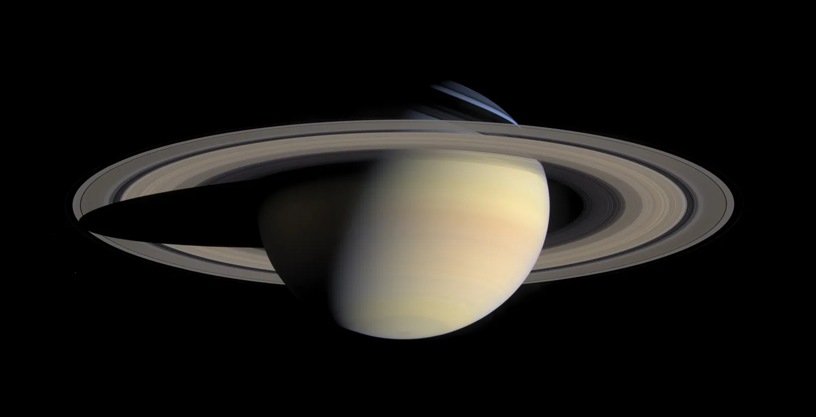 Saturn and its full ring system in a mosaic by the Cassini spacecraft, with the planet's shadow falling across the rings.