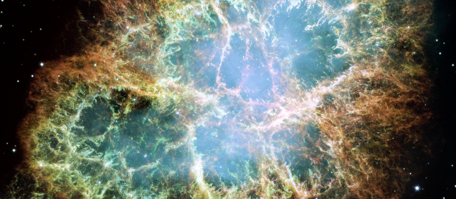 The Crab Nebula, the expanding remnant of the supernova of 1054 with a pulsar at its center, seen by the Hubble Space Telescope